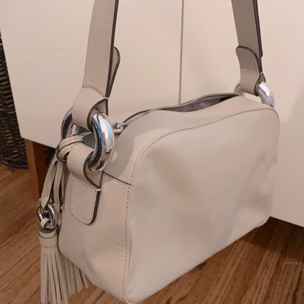 Michael Kora leather shoulder bag w/tassel detail.